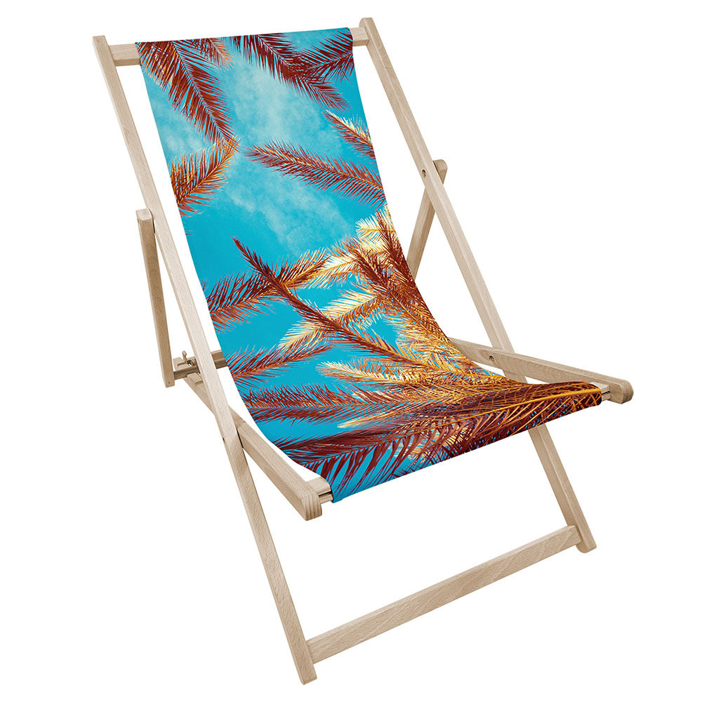 Leżak drewniany z nadrukiem BRĄZOWE LIŚCIE PALM NA TLE NIEBA